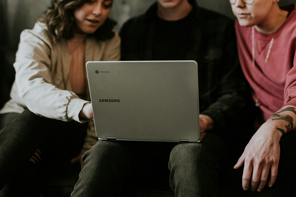 Multiple people collaborating in coworking office